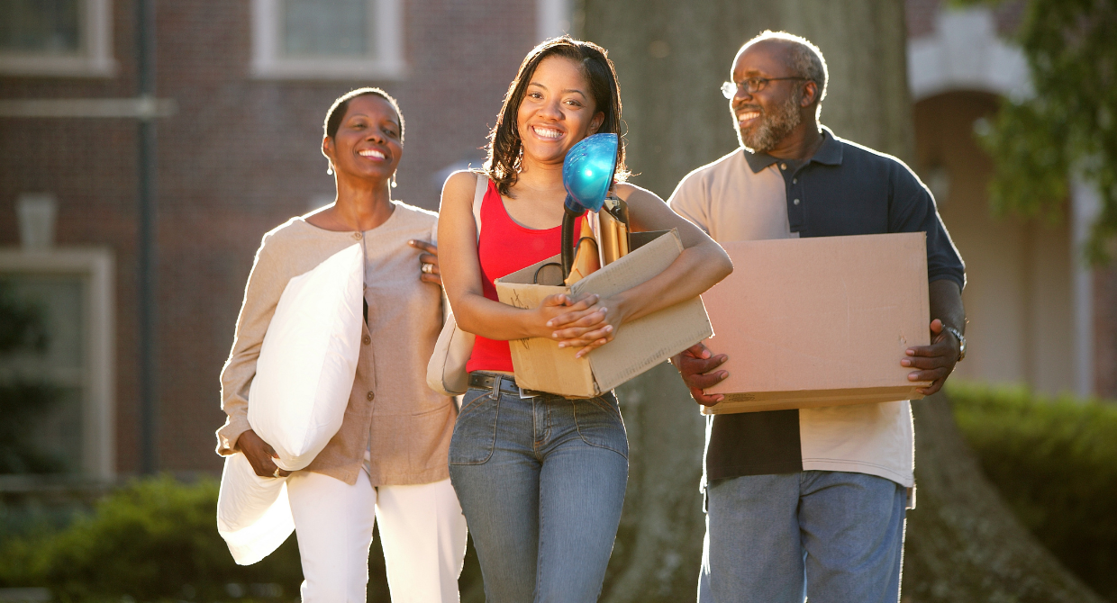 Parents helping their college graduate living at home