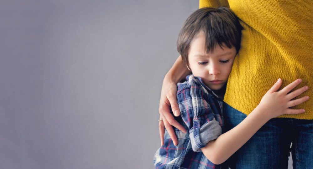 Little boy hugging his mom