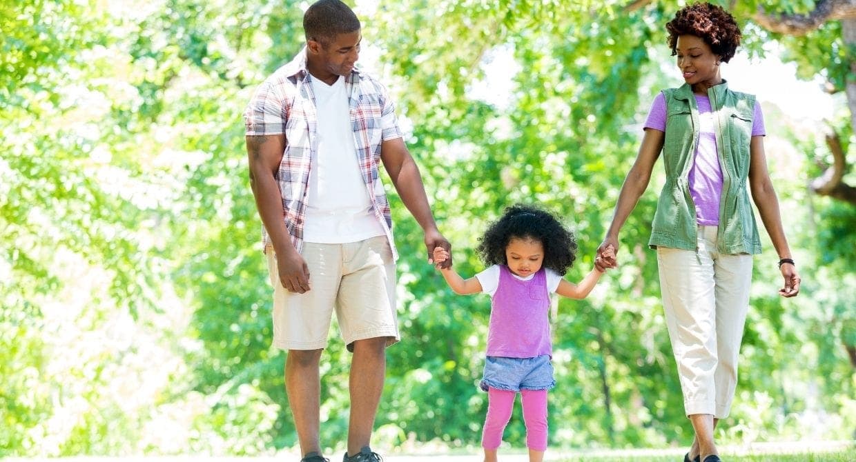 young african american family holding hands