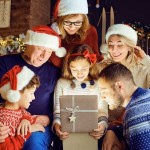 family gathered opening christmas present