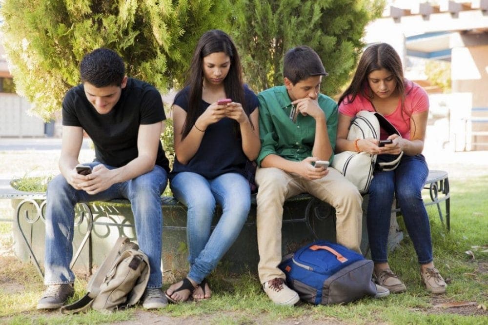 Teens Busy on Cell Phones